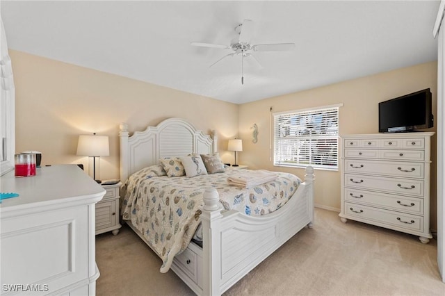 bedroom featuring ceiling fan and light carpet