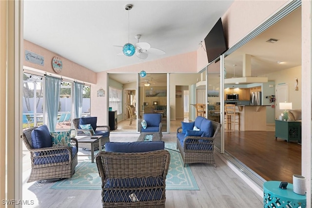 interior space with ceiling fan and lofted ceiling