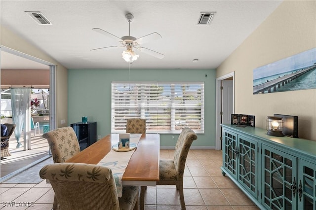 tiled dining room featuring ceiling fan