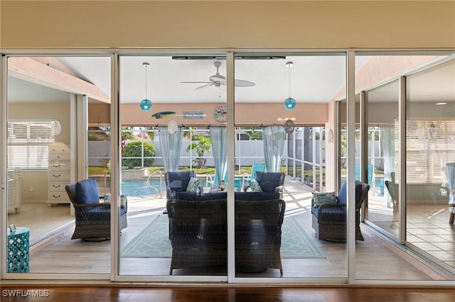 doorway to outside with hardwood / wood-style flooring and ceiling fan