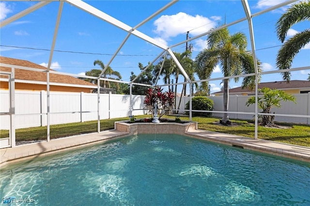 view of swimming pool with a lanai