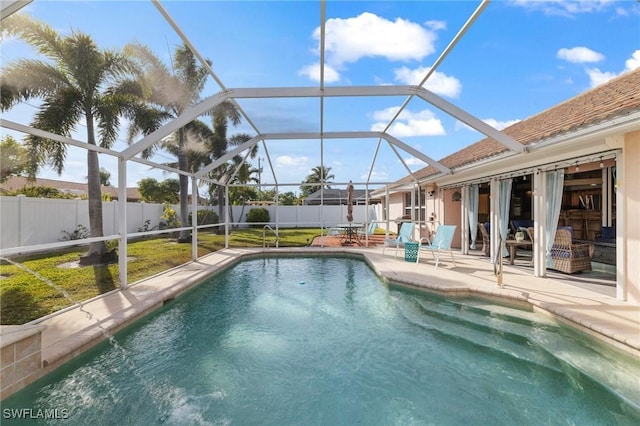 view of pool featuring a patio and glass enclosure