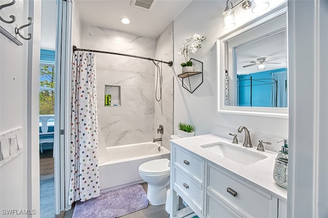 full bathroom featuring shower / tub combo, vanity, toilet, and ceiling fan