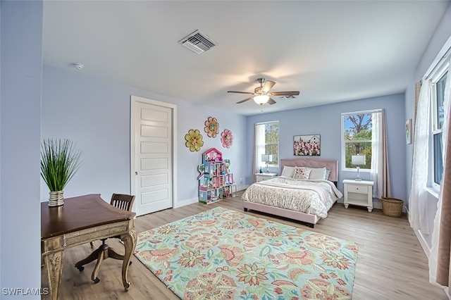 bedroom featuring light hardwood / wood-style flooring and ceiling fan