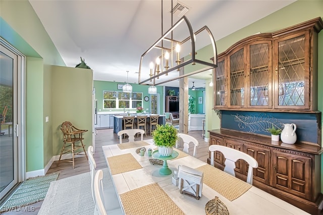 dining area with light hardwood / wood-style floors