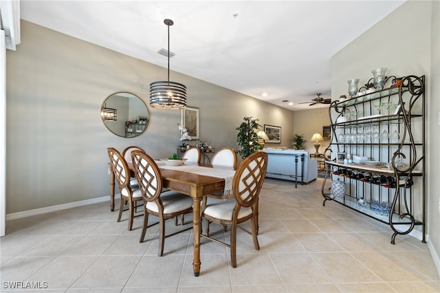 tiled dining room with ceiling fan