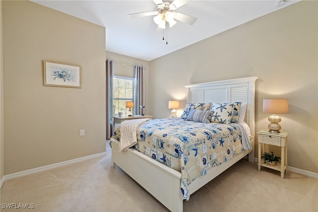 bedroom with ceiling fan and light colored carpet