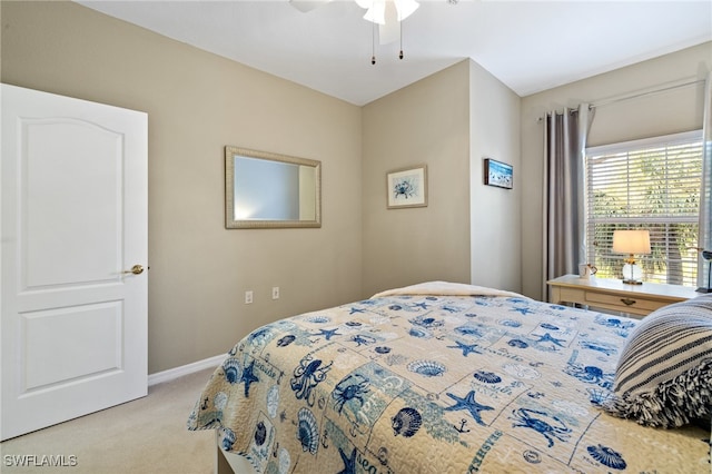 bedroom with ceiling fan and light colored carpet