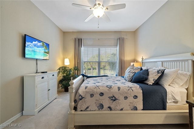 carpeted bedroom featuring ceiling fan