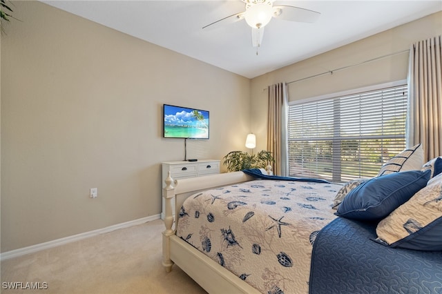 bedroom with light colored carpet and ceiling fan