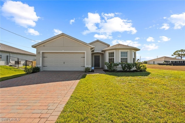 single story home featuring a garage and a front yard