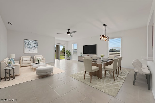 tiled dining room with ceiling fan