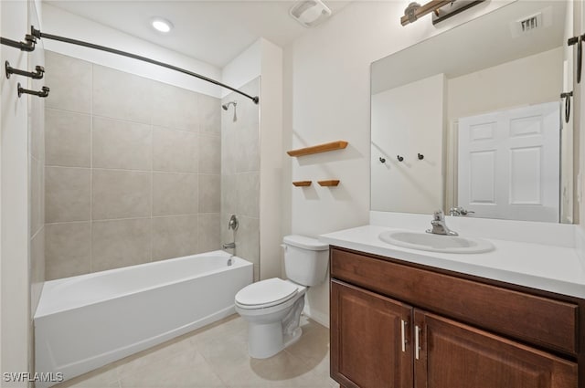 full bathroom with vanity, tiled shower / bath combo, and toilet