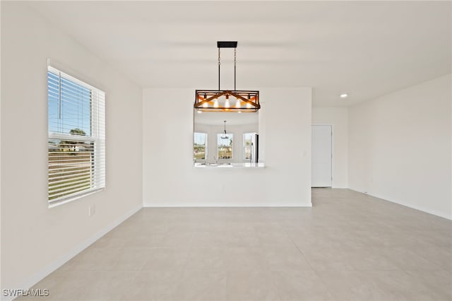 unfurnished room with light tile patterned floors