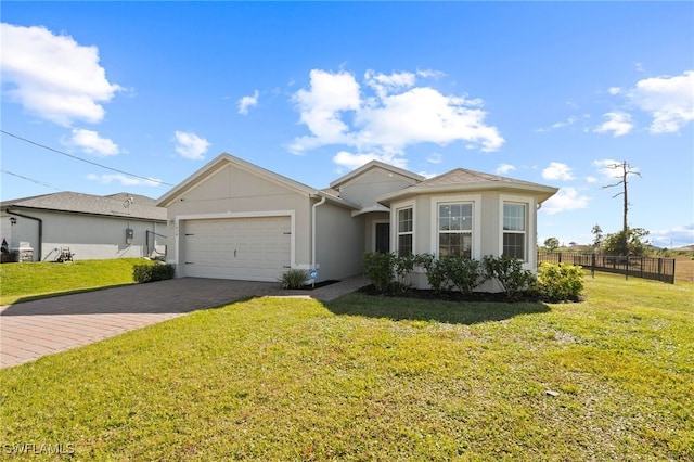 ranch-style home with a garage and a front yard