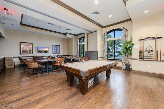 game room with a raised ceiling, ornamental molding, hardwood / wood-style floors, and billiards