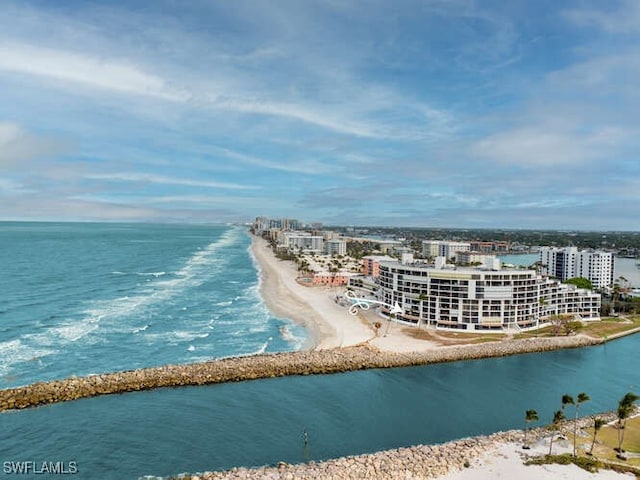 bird's eye view with a water view and a view of the beach