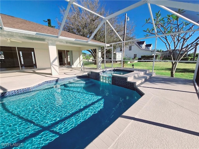 view of pool featuring a lanai, a patio, and an in ground hot tub