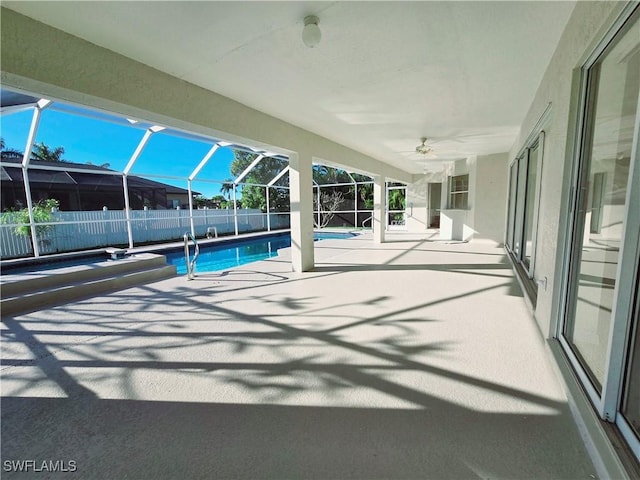 view of pool featuring a patio and glass enclosure