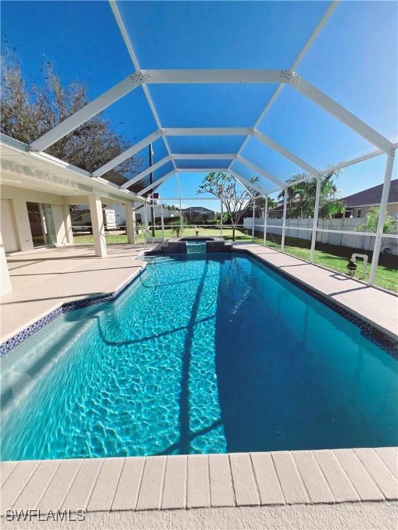 view of pool with a lanai and a patio