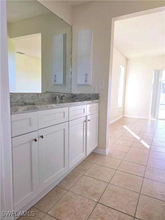 bathroom featuring tile patterned floors and vanity