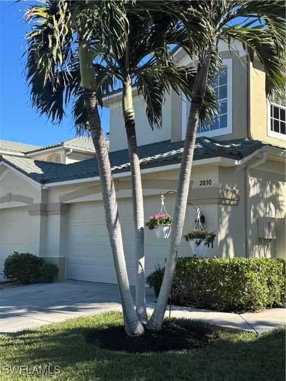 view of side of property with a garage