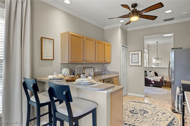 kitchen featuring a kitchen breakfast bar, hanging light fixtures, ornamental molding, light tile patterned floors, and kitchen peninsula