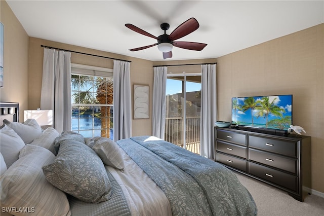 carpeted bedroom featuring ceiling fan and access to outside