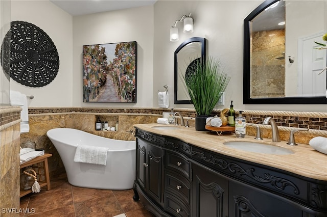 bathroom with a tub to relax in, tile walls, and vanity