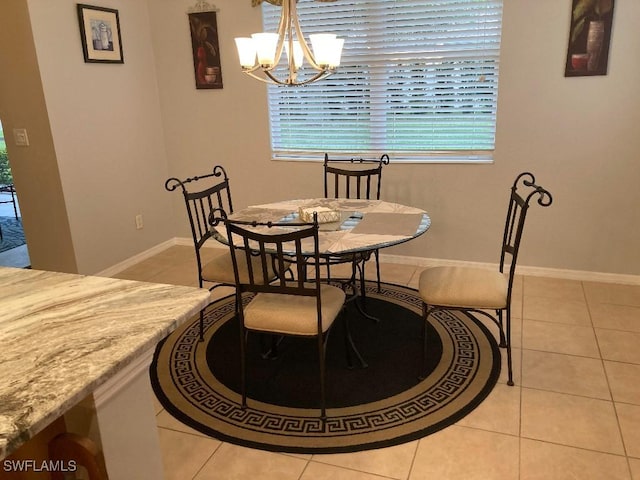 tiled dining area with a notable chandelier