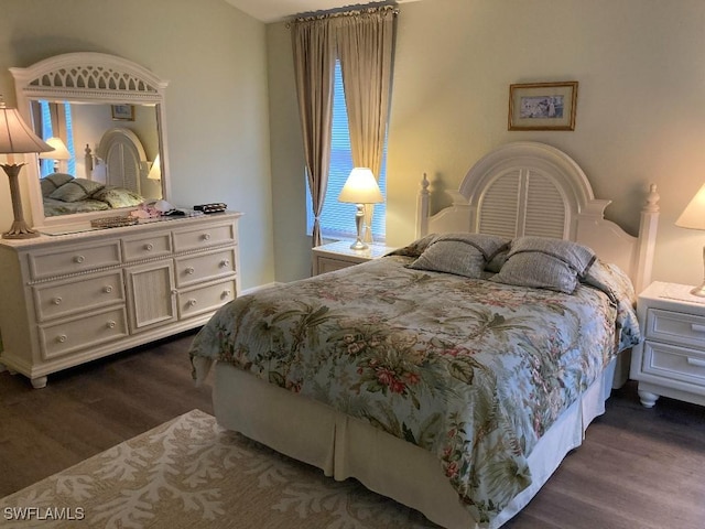 bedroom featuring dark hardwood / wood-style flooring