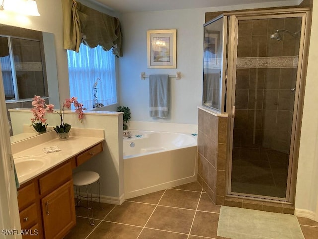 bathroom featuring tile patterned flooring, vanity, and independent shower and bath