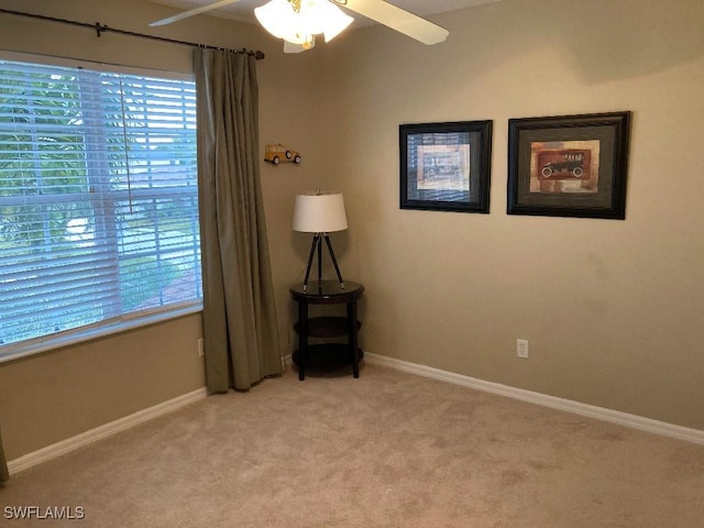 carpeted empty room with ceiling fan