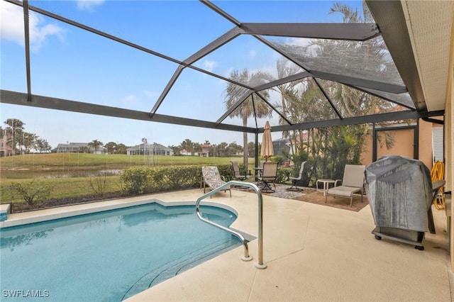 view of pool with a patio and a lanai