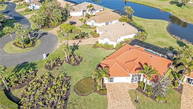 birds eye view of property featuring a water view