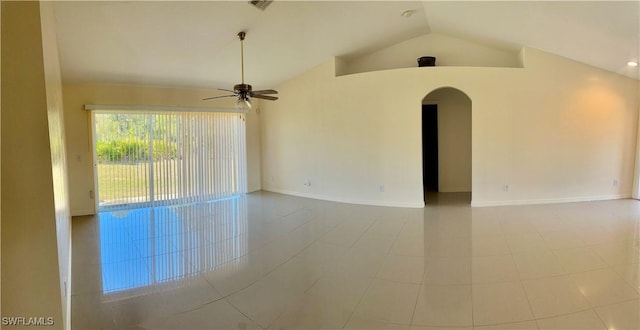 empty room featuring ceiling fan and high vaulted ceiling