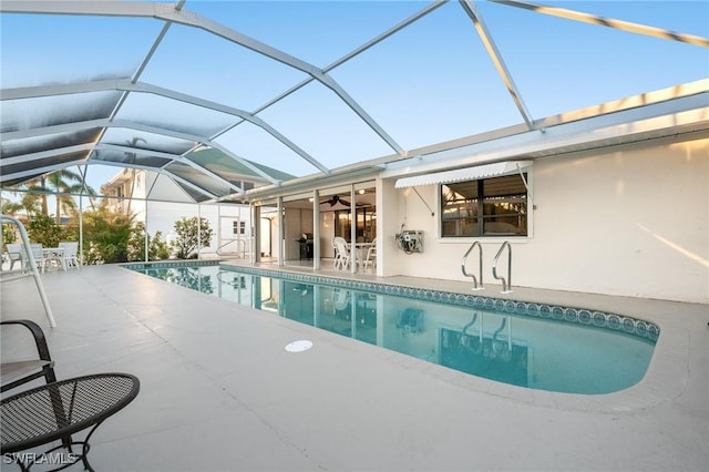 view of pool with a lanai and a patio area