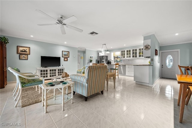 living room with crown molding, light tile patterned floors, and ceiling fan