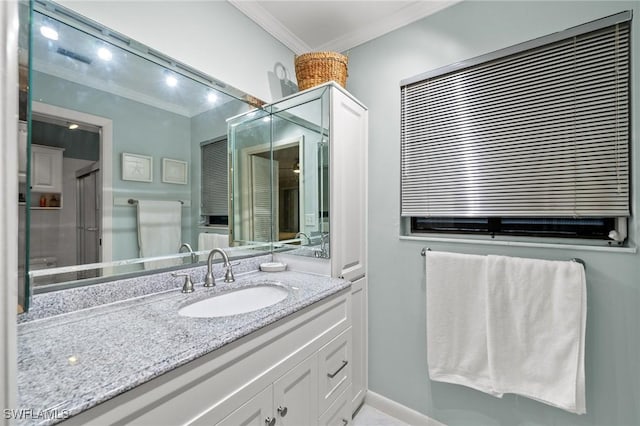 bathroom with crown molding and vanity