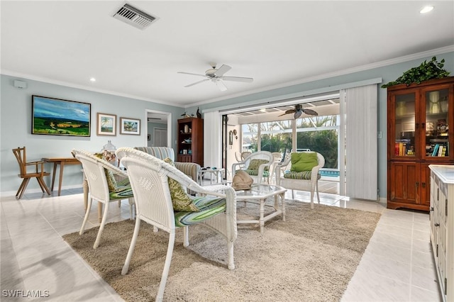 tiled living room with ceiling fan and ornamental molding