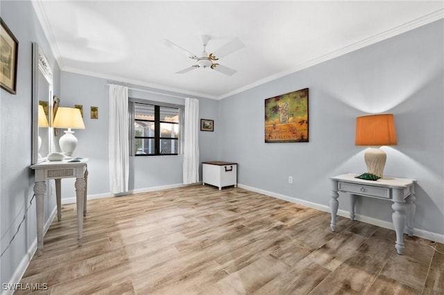 interior space featuring crown molding, ceiling fan, and light wood-type flooring