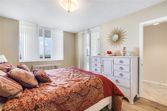 bedroom with light hardwood / wood-style flooring