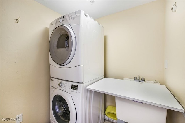 washroom with stacked washer / dryer