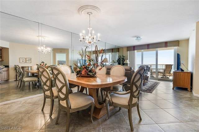 dining room featuring tile patterned flooring and a notable chandelier