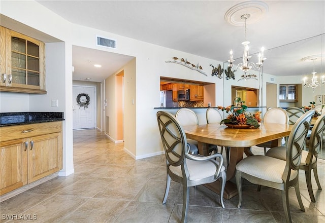 dining room featuring a chandelier