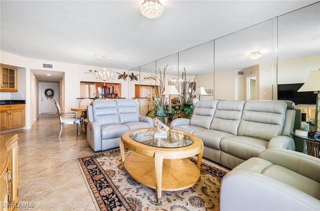 living room featuring a notable chandelier