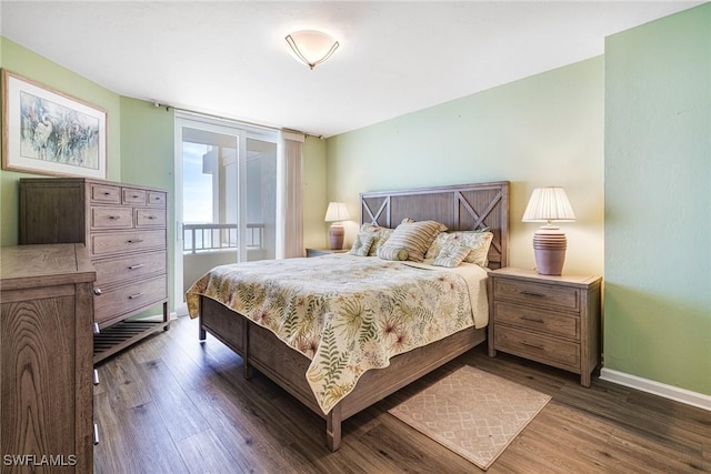 bedroom with dark hardwood / wood-style flooring