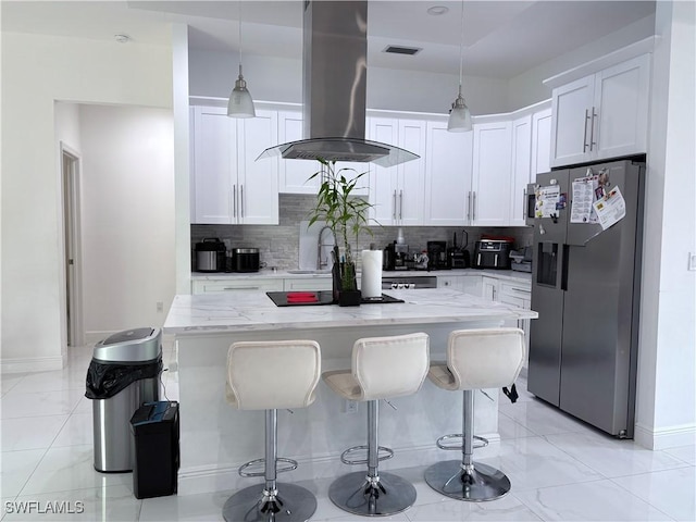 kitchen featuring white cabinetry, island range hood, backsplash, and stainless steel fridge with ice dispenser