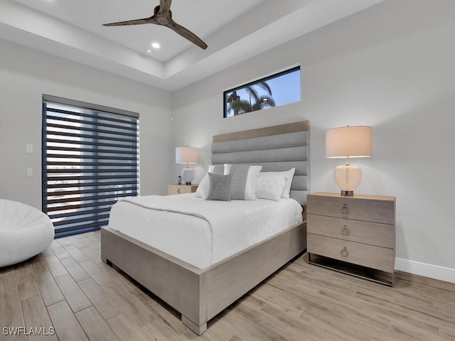 bedroom featuring light hardwood / wood-style flooring and ceiling fan