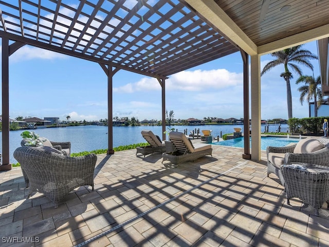 view of patio / terrace featuring a water view and a pergola